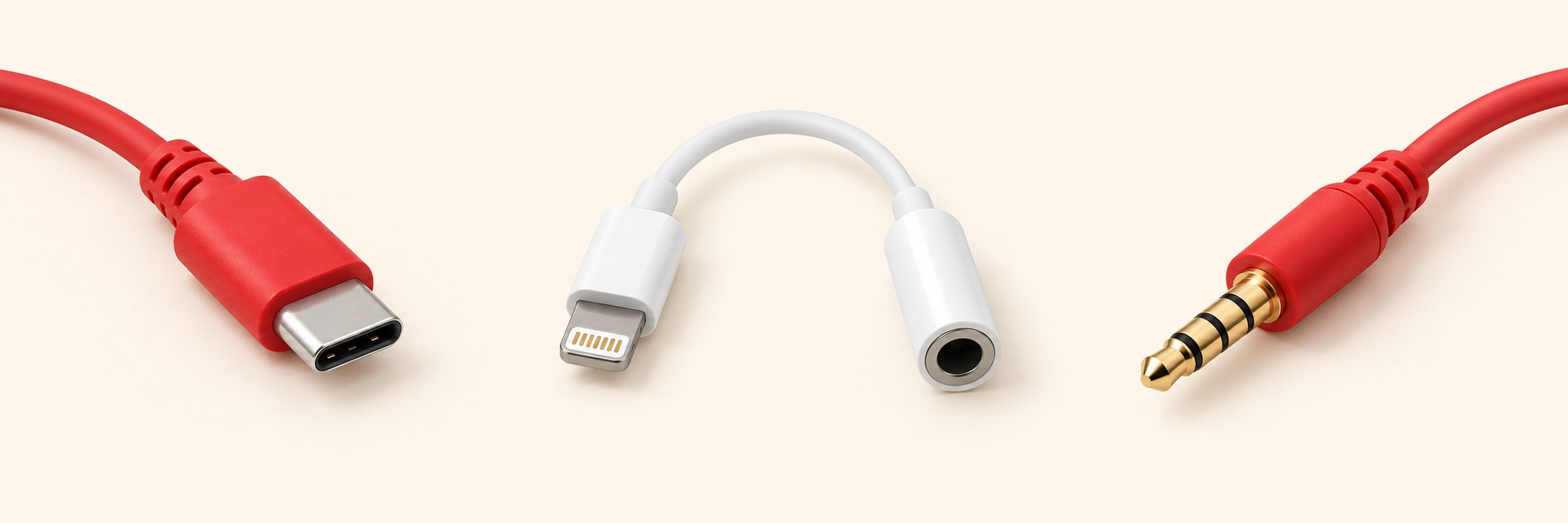 USB-C plug, Lightning adapter, and 3.5 mm headset plug, from left to right.